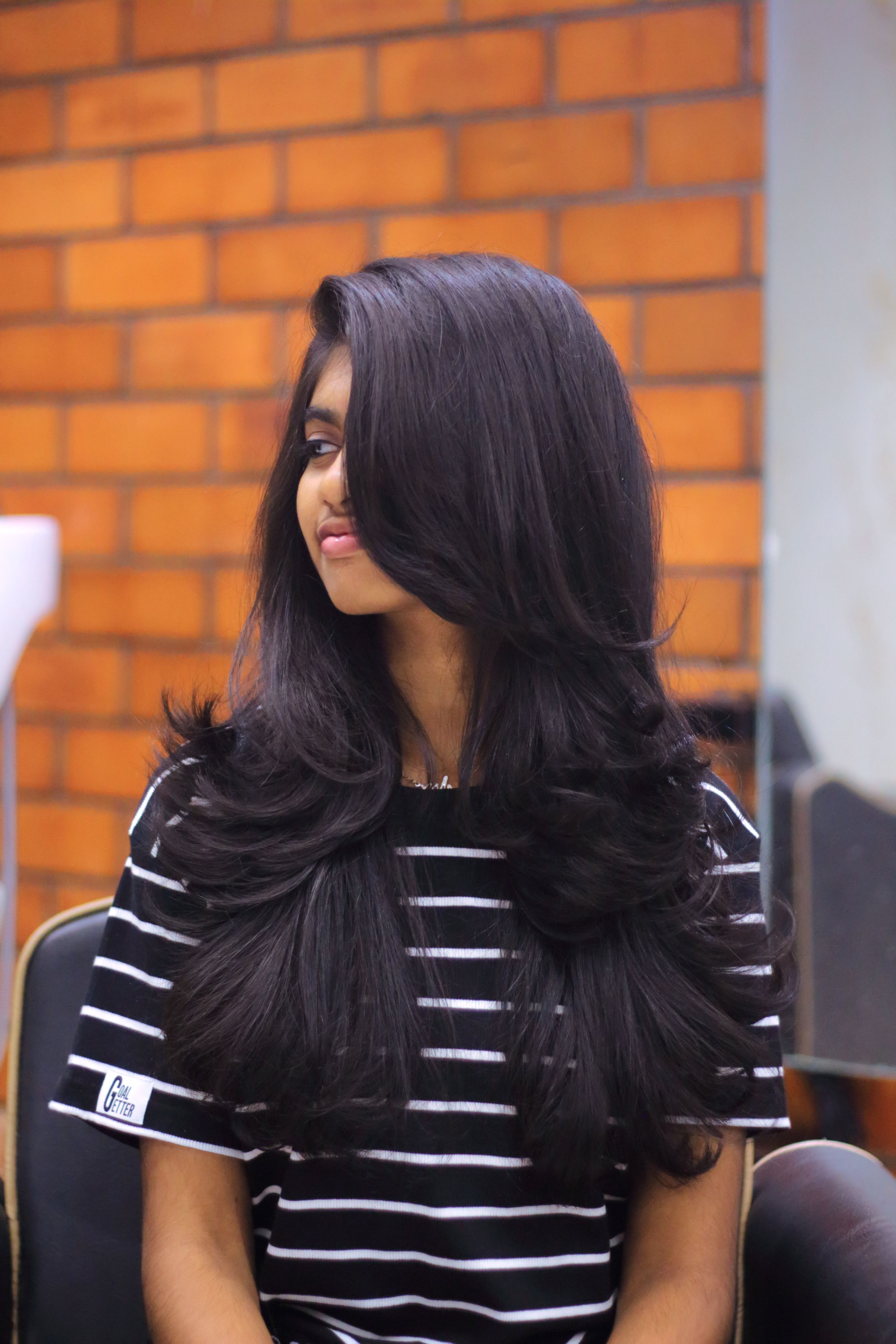 women with long layered haircut